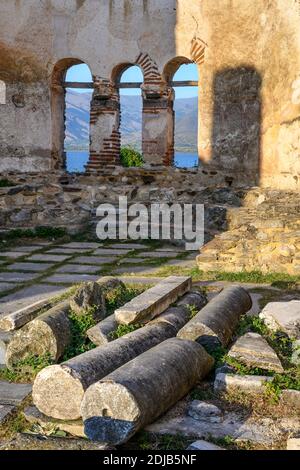 The 10 century ruines of Saint Achilleios Basilica on the island of Agios Achilleios on Mikri Prespa lake, Macedonia, Northern Greece. Stock Photo