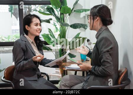 Young asian business woman meeting in a cafe Stock Photo