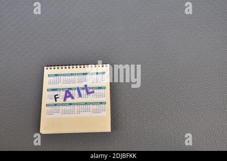 2020 calendar, with the text Fail, the year that failed, which did not exist, on a black background with colored letters Stock Photo