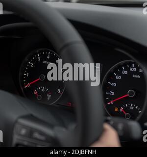 Speedometer in the car on the dashboard at night. Selective focus Stock Photo
