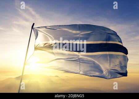 Botswana flag waving on the top sunrise mist fog Stock Photo