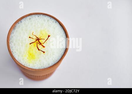 authentic cold drink of Punjab province, India. lassi is a sweet drink made of curd, milk, sugar. usually lassie is served in clay glasses or mud pots. Stock Photo