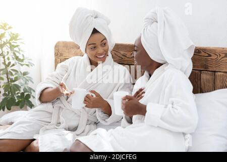 Two beautiful ladies enjoying time together at home Stock Photo