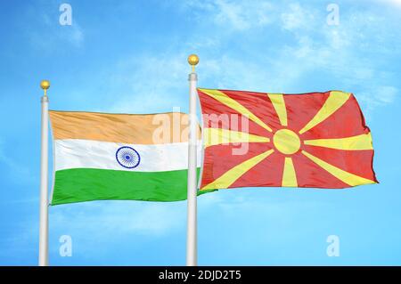 India and North Macedonia two flags on flagpoles and blue cloudy sky Stock Photo