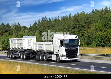 White Next Generation Scania R650 truck pulls gravel trailer on road test. Scania in Finland 70 years tour. Turku, Finland. August 24, 2019. Stock Photo