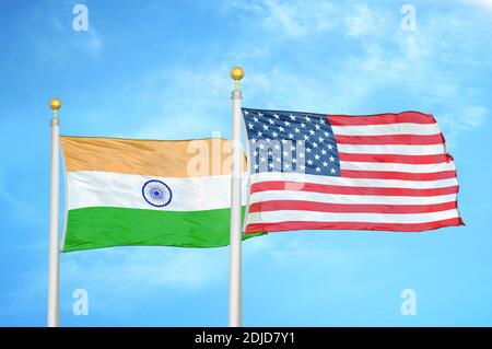 India and United States two flags on flagpoles and blue cloudy sky Stock Photo