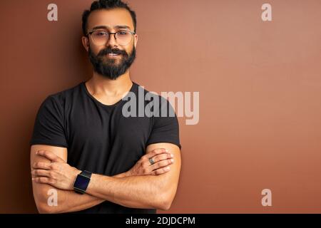 confident concentrated arabic male posing isolated in studio, indian arabian modern man smiling Stock Photo