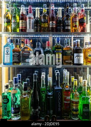 Spirit bottles on display. A shop window of an absinthe shop in central Prague with some unusual alcoholic drinks available. Stock Photo