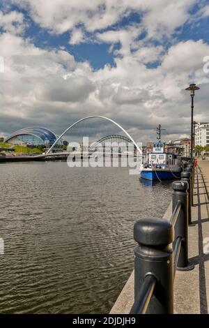 Docked boats, River Tyne and Gateshead Millennium Bridge, Quayside, Newcastle, Northumberland, England, United Kingdom Stock Photo