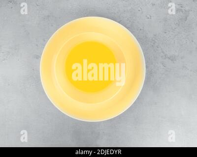 picnic illuminating yellow cutlery utensils, plates, cups, fork, spoon and knife on trendy ultimate grey background. Eco friendly, plastic garbage for Stock Photo