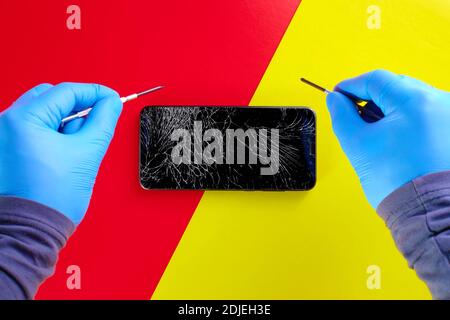Repair of mobile phones and gadgets. Mobile device workshop ads on a red and yellow background. Stock Photo