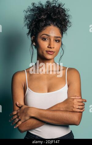 Stock photo of pretty and expressive woman with cool makeup posing in studio shot. Stock Photo