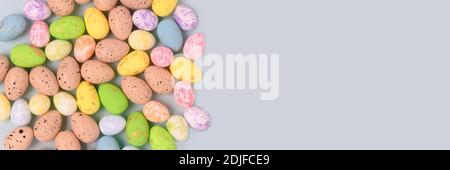 Pattern made of colorful easter eggs on a blue pastel background. Holiday creative concept. Stock Photo