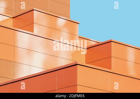 Modern building facade detail, abstract architectural metal shape against blue sky Stock Photo