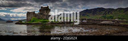 Early morning sunlight over Eilean Donan Castle at Kyle of Lochalsh in the Western Highlands of Scotland Stock Photo