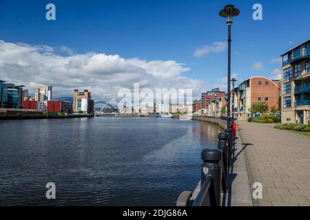 River Tyne and Gateshead Millennium Bridge (green Tyne Bridge in background), Quayside, Newcastle, Northumberland, England, United Kingdom Stock Photo