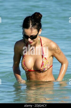 Exclusive!! Italian beauty Nina Moric spends a day on Miami Beach with partner Fabrizzio Corona, her mother and her son. Stock Photo