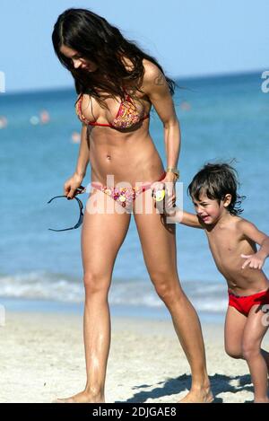 Exclusive!! Italian beauty Nina Moric spends a day on Miami Beach with partner Fabrizzio Corona, her mother and her son. Stock Photo