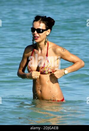 Exclusive!! Italian beauty Nina Moric spends a day on Miami Beach with partner Fabrizzio Corona, her mother and her son. Stock Photo