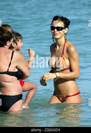 Exclusive!! Italian beauty Nina Moric spends a day on Miami Beach with partner Fabrizzio Corona, her mother and her son. Stock Photo