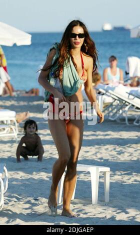 Exclusive!! Italian beauty Nina Moric spends a day on Miami Beach with partner Fabrizzio Corona, her mother and her son. Stock Photo