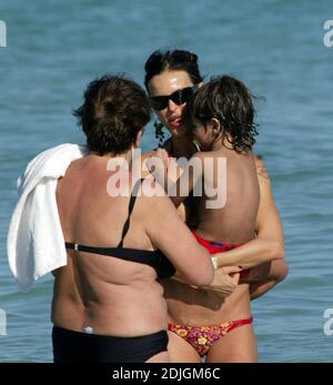 Exclusive!! Italian beauty Nina Moric spends a day on Miami Beach with partner Fabrizzio Corona, her mother and her son. Stock Photo