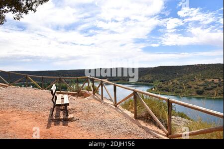 Viewpoint with a wooden bench of the Ruidera lagoons. Stock Photo