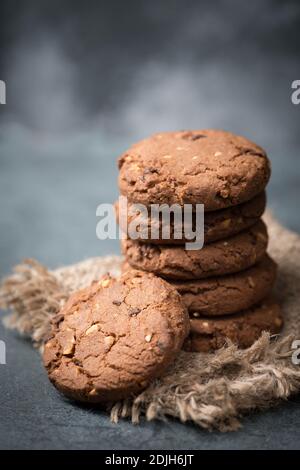 Cookies with hazelnuts and chocolate, dark moody sweets, empty copy space for text Stock Photo
