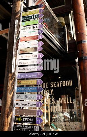 Signs at the Tannery shopping center outside Newburyport Fish market in historic mill buildings on Water Street in Newburyport, Massachusetts, USA. Stock Photo