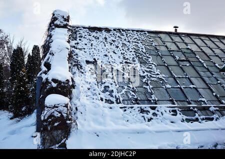 White snow cover on glass roof top of house. Snow pattern on the surface Stock Photo