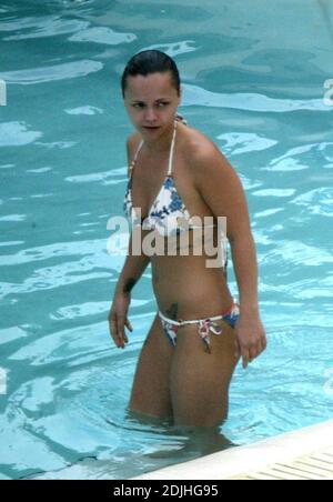 Exclusive!! Christina Ricci spends an afternoon poolside at a Miami Beach hotel. The actress spent the day with five girlfriends, drank, smoked, swam, clowned around and chatted to handsome pool attendants.  5/12/05 Stock Photo