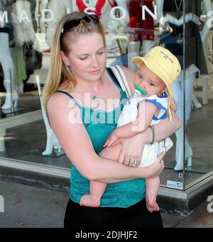 Actress Melissa Joan Hart, best known as the TV star of 'Sabrina the Teenage Witch,' went shopping with baby son at Kitson and Kitson Kids in LA with a friend. After shopping they retired to the News Cafe to escape the heat. 6/16/06 Stock Photo