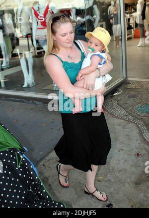 Actress Melissa Joan Hart, best known as the TV star of 'Sabrina the Teenage Witch,' went shopping with baby son at Kitson and Kitson Kids in LA with a friend. After shopping they retired to the News Cafe to escape the heat. 6/16/06 Stock Photo