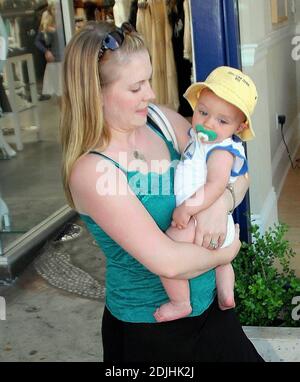 Actress Melissa Joan Hart, best known as the TV star of 'Sabrina the Teenage Witch,' went shopping with baby son at Kitson and Kitson Kids in LA with a friend. After shopping they retired to the News Cafe to escape the heat. 6/16/06 Stock Photo