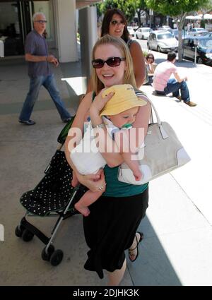 Actress Melissa Joan Hart, best known as the TV star of 'Sabrina the Teenage Witch,' went shopping with baby son at Kitson and Kitson Kids in LA with a friend. After shopping they retired to the News Cafe to escape the heat. 6/16/06 Stock Photo