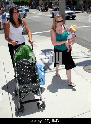 Actress Melissa Joan Hart, best known as the TV star of 'Sabrina the Teenage Witch,' went shopping with baby son at Kitson and Kitson Kids in LA with a friend. After shopping they retired to the News Cafe to escape the heat. 6/16/06 Stock Photo