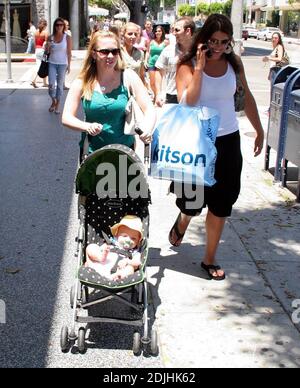 Actress Melissa Joan Hart, best known as the TV star of 'Sabrina the Teenage Witch,' went shopping with baby son at Kitson and Kitson Kids in LA with a friend. After shopping they retired to the News Cafe to escape the heat. 6/16/06 Stock Photo