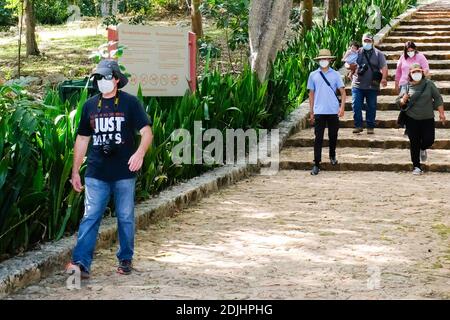 Visitors wearing face masks visiting Uxmal Mayan Ruins in Yucatan Mexico during the Covid-19 Pandemic, December 2020. Stock Photo