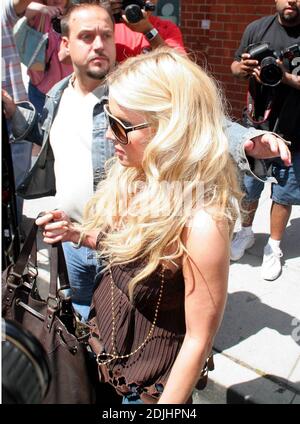 Jessica Simpson lunched at Mr Chow in Beverly Hills with a friend and bodyguard. Simpson looked tense as she sped away in her limousine. 6/21/06 Stock Photo