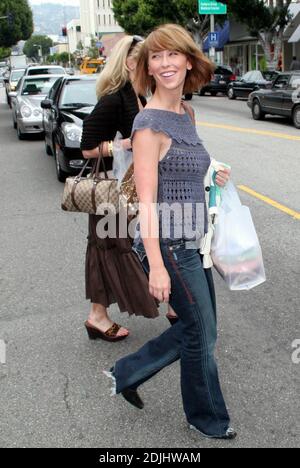 Jennifer is such a love! The caring actress was shopping on Robertson Blvd in Los Angeles, Ca. accompanied by a pack of photographers when one suddenly tripped and fell. Love Hewitt helped the female photographer to her feet and gave her a hug to make sure she was alright. 'She was genuinely concerned and very sweet,' said one onlooker. The actress even had a bottle of water brought over for her. 4/28/06 Stock Photo