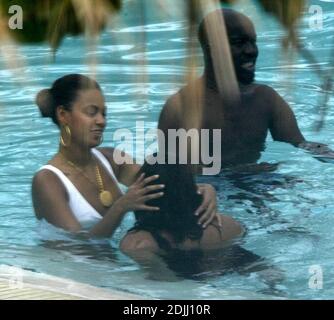 https://l450v.alamy.com/450v/2djj10r/exclusive!!-beyonce-knowles-frolicks-in-the-pool-plays-with-a-friends-hair-and-does-handstands-during-memorial-day-weekend-her-mood-was-noticeably-brighter-than-when-seen-with-boyfriend-jay-z-during-her-last-visit-2-weeks-previously-when-the-couple-were-rumored-to-have-had-an-argument-miami-beach-fl-52706-2djj10r.jpg