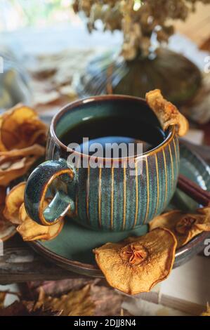 hot drink made from pear chips and spices with cinnamon. Autumn still life with a warming drink. Stock Photo