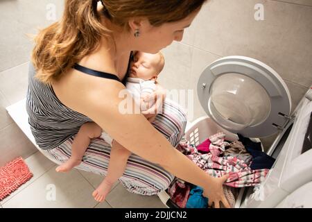 Performing role of good mother and perfect housewife Stock Photo