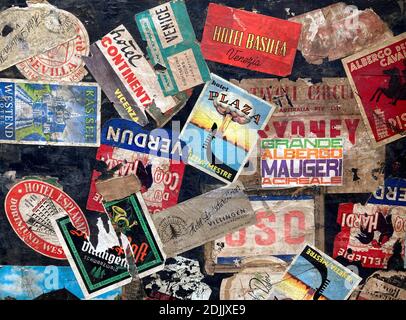 Vintage Luggage Labels on a Suitcase Stock Photo