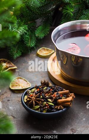 Mulled wine ingredients assortment in a dark bowl Stock Photo