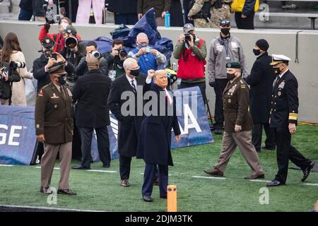 U.S. President Donald Trump waves as he arrives for the 121st Army-Navy football game at Michie Stadium December 12, 2019 in West Point, New York. The Army Black Knights shutout the Navy Midshipmen 15-0. Stock Photo