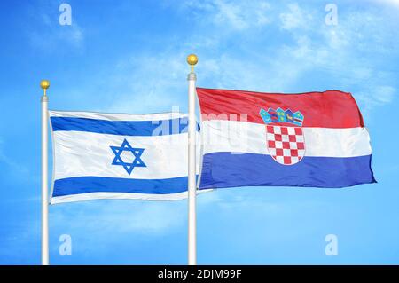 Israel and Croatia two flags on flagpoles and blue cloudy sky Stock Photo