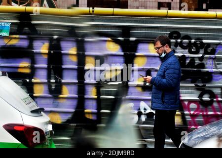 A man looking at his smartphone in the street, Barcelona. Stock Photo