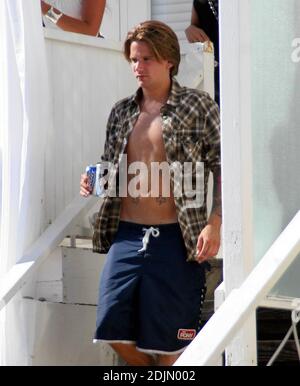 Sean Stewart, son of rocker Rod and a regular at AA meetings, seems to have spent spent a boozy afternoon at an Independence Day party hosted by Smashbox Cosmetics at The Polaroid Beach House.  A concerned pal appears to have taken him aside after he started looking woozy. Malibu, Calif. 7/4/06. Stock Photo
