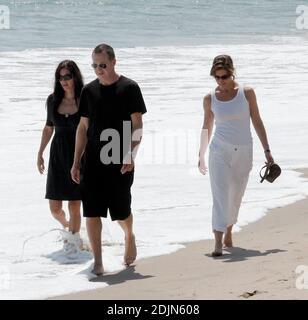 Is Courtney Cox hiding a pregnancy bump behind her empire waist dress? The actress took a stroll on the beach with friends in Malibu, Ca. 7/22/06 Stock Photo